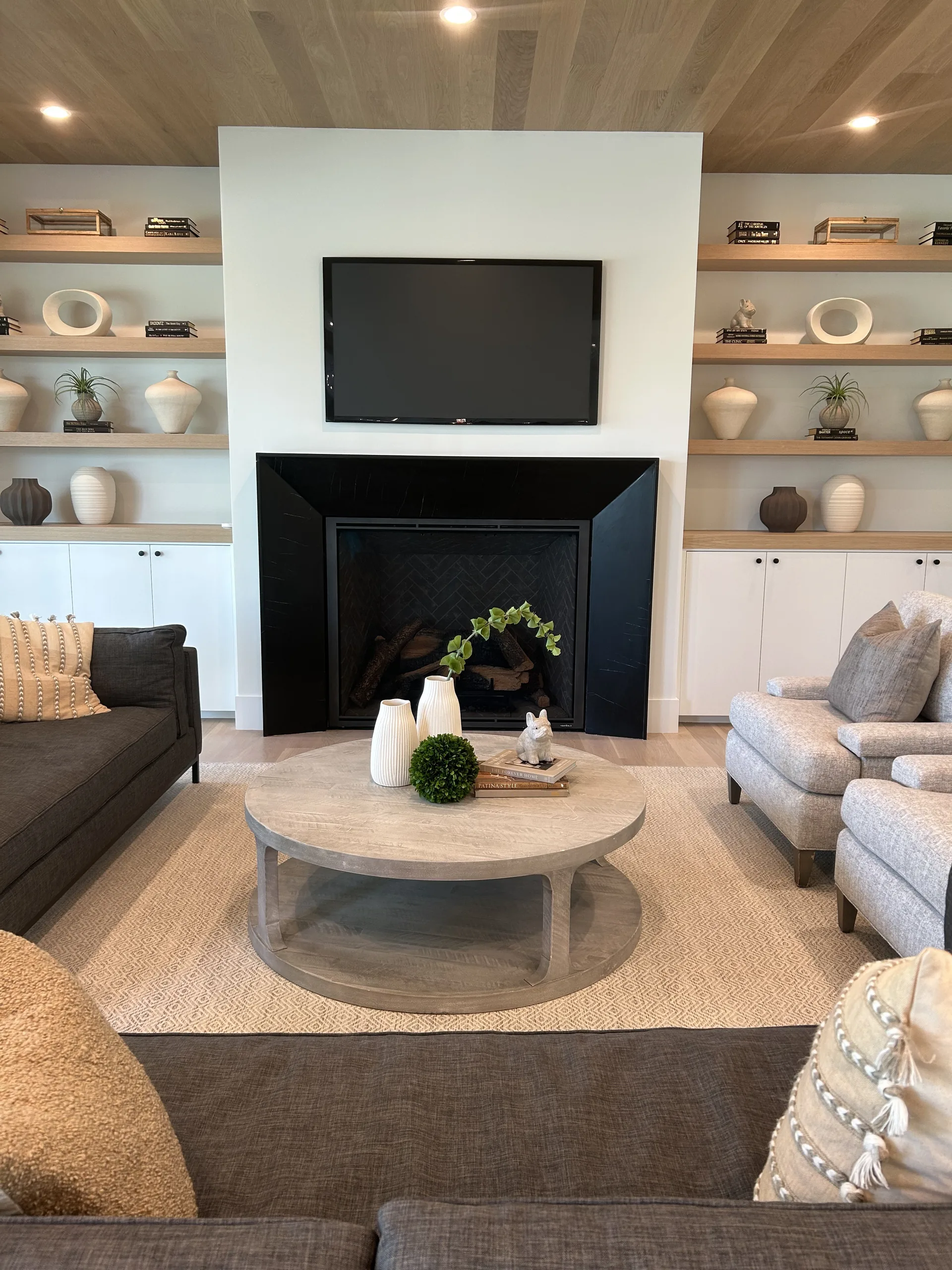 A family great room with fireplace and built-in shelving in a Westport, Connecticut home